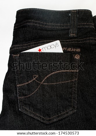 DAYTON, OHIO - FEBRUARY 2, 2014: DKNY designer jeans pocket with Macy\'s credit card. DKNY is clothing by NYC designer, Donna Karan; Macys is USAs largest retail department store in retail sales.
