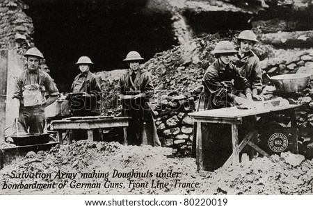 FRANCE - CIRCA 1914-1918: Salvation Army making Donuts - postcard depicting Salvation Army making donuts under bombardment of German guns while in front line in France during WWI, circa 1914-1918.