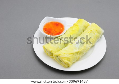 egg rolls and Sweet chili sauce Place on white plate