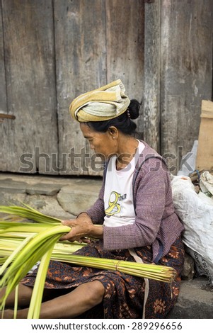 PENIDA ISLAND, INDONESIA - JUNE 21.2015:  woman Hindu at the market, village Toyopakeh, Nusa Penida June 21. 2015 Indonesia