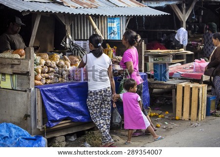 PENIDA ISLAND, INDONESIA - JUNE 22.2015:  woman Hindu at the market, village Toyopakeh, Nusa Penida June 22. 2015 Indonesia
