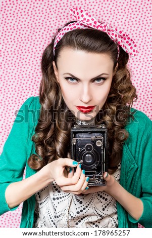 Style woman with old camera