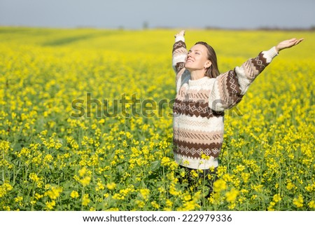 Young woman on flower field and sky enjoy life. concept