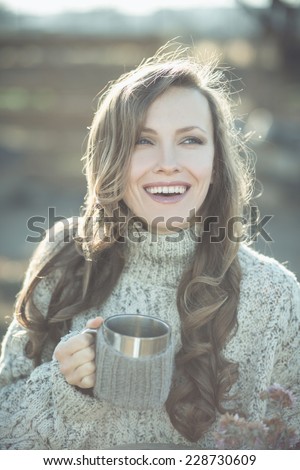 Happy young woman drinking tea and enjoy the freshness of the new day. Happiness. emotions. tone image