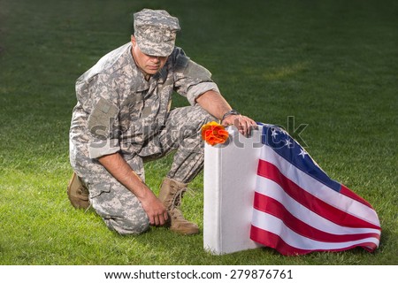 Soldier on american cemetery. Memorial Day concept