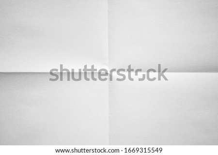 White paper folded in four fraction background Foto d'archivio © 