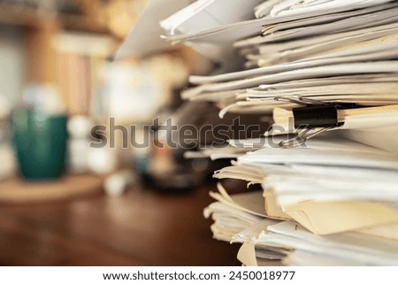 Similar – Image, Stock Photo A messy stack of file folders lies on a desk