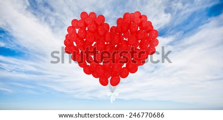 red heart shaped balloons floating in the sky