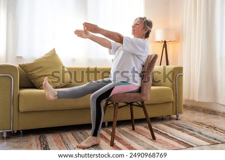 Image, Stock Photo Senior woman exercising at home