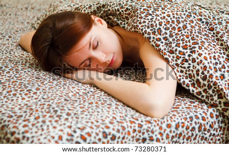 Portrait of a young girl sleeping on a pillow