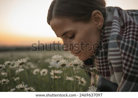 Similar – Image, Stock Photo Young woman smelling flower in the field