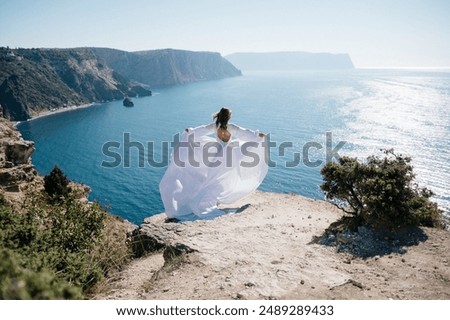 Image, Stock Photo Female standing on cliff and contemplating