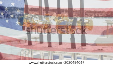 American flag waving against close up of fishing rods in background. american independence and celebration concept