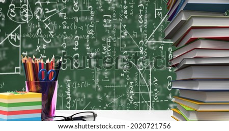 School stationary items and glasses against mathematical equations floating on green background. school and education concept