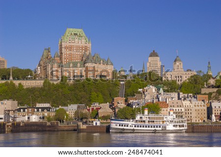 QUEBEC CITY, QUEBEC, CANADA - MAY 29, 2004: Le Chateau Frontenac castle and hotel, and St. Lawrence River ferry boat, in Old Quebec City.