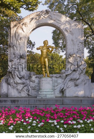 VIENNA, AUSTRIA - SEPTEMBER 14, 2003: Golden statue of music composer Johann Strauss, playing the violin, in the Stadtpark park.
