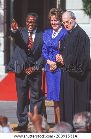 WASHINGTON, DC, USA - Clarence Thomas, Supreme Court nominee, swearing in ceremony at White House. With wife Virginia and Justice Byron White. October 18, 1991