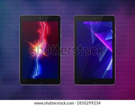Two tablet black color with abstract neon geometric and lightning bolt touch screen and flare isolated on wall background. Realistic and detailed device. Stock vector illustration.