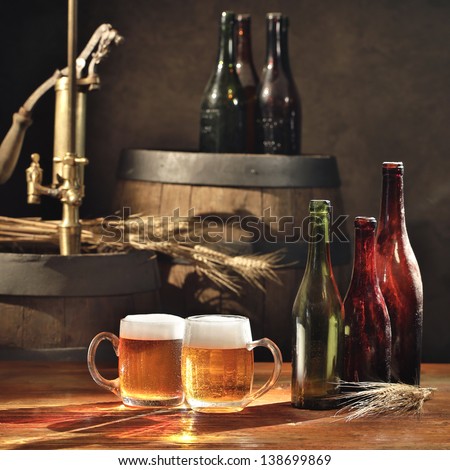 beer still life on the table with old  beer kegs tap
