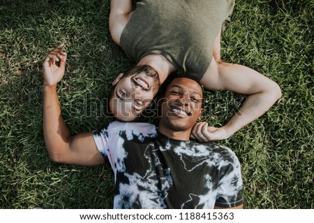 Similar – Image, Stock Photo Diverse couple chilling on floats