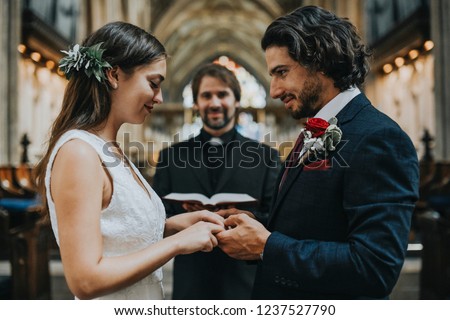 Similar – Image, Stock Photo Pastor at the altar table with the book of baptism