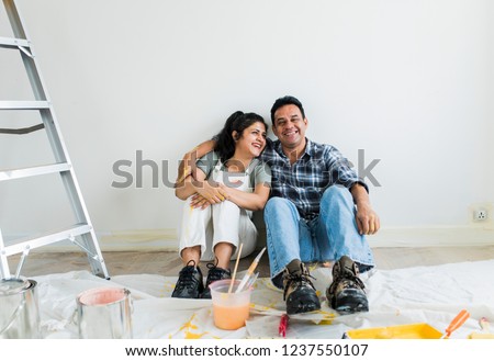 Couple resting after painting the room Foto stock © 