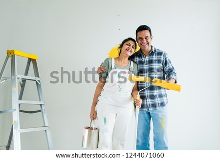 Similar – Image, Stock Photo Cheerful woman preparing paint during renovation