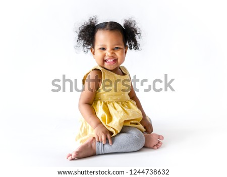 Similar – Image, Stock Photo Young baby sits up in bed with stuffed animal toys; child wearing diaper