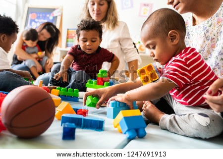 Similar – Image, Stock Photo Toddler playing with toy