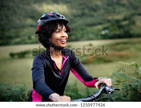 Similar – Image, Stock Photo Female cyclist in helmet practicing on training track