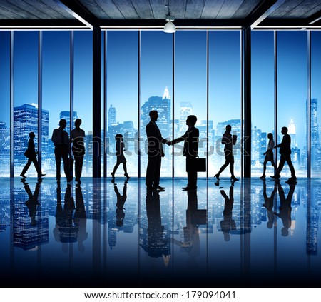 Silhouette of Busy Business People in an Office Building