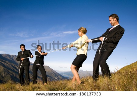 Business People Playing Tug of War on The Mountain, New Zealand