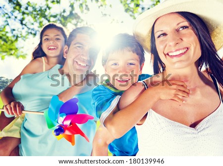 Parents Giving Their Kids a Piggy Back in The Park