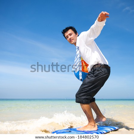Businessman having fun on a paradise beach.