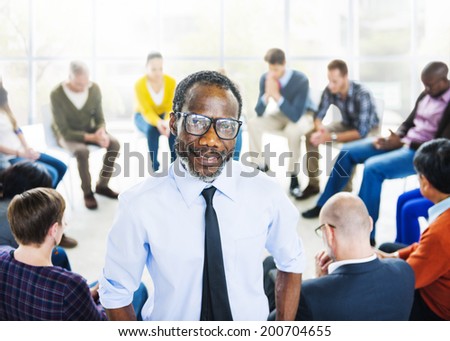 African Descent Man and Praying Group of People