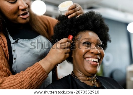 Similar – Image, Stock Photo African American woman getting makeup in studio