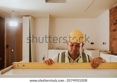 Middle aged man remodeling a home Photo stock © 