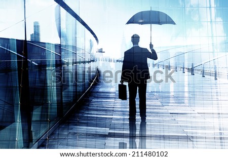 Depressed Businessman Standing While Holding an Umbrella