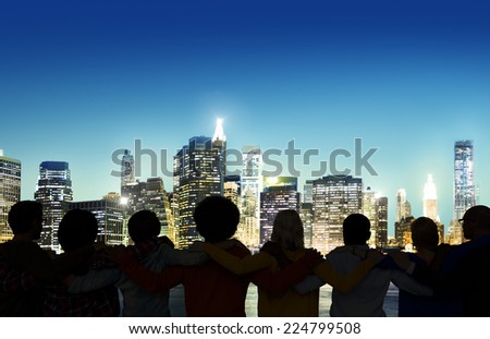 Silhouettes of people\'s back with a view of urban scene.