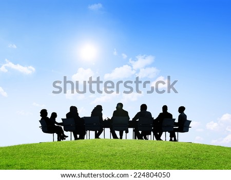 Business people having an outdoor meeting.