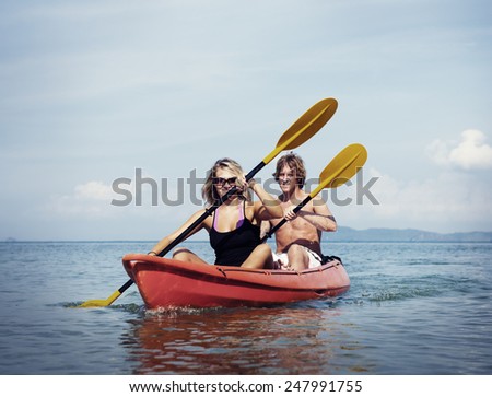 Travel Beach Adventure Kayaking Couple Holiday Concept