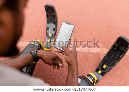 Similar – Image, Stock Photo Disabled athlete using phone