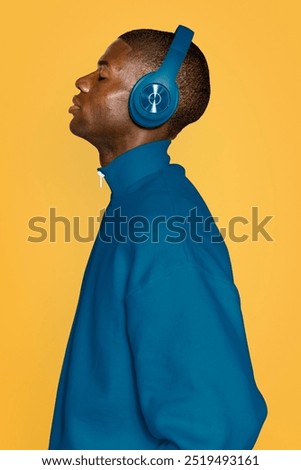 Similar – Image, Stock Photo A man with headphones pulls on his tongue with pliers