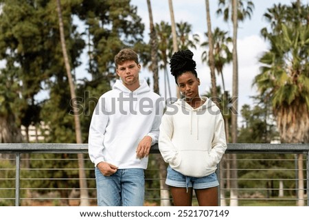Similar – Image, Stock Photo Diverse couple chilling on floats