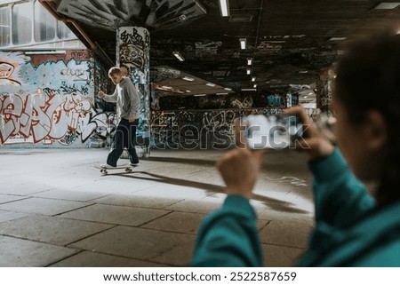 Similar – Image, Stock Photo Skater performing trick on ramp in skate park