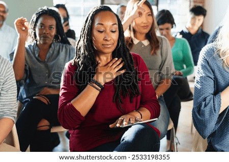 Similar – Image, Stock Photo Group of calm focused women and men practicing yoga with trainer standing in balance pose and stretching body in studio