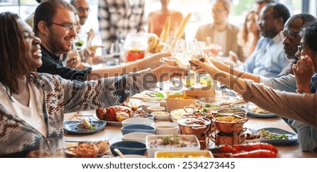 Similar – Foto Bild Glücklich diverse Freunde stoßen Gläser im Cafe an