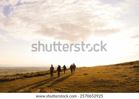 Similar – Image, Stock Photo Woman walking on grassy shore