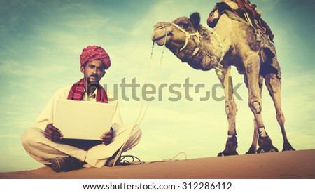 Indian Man Using Laptop Desert Concept