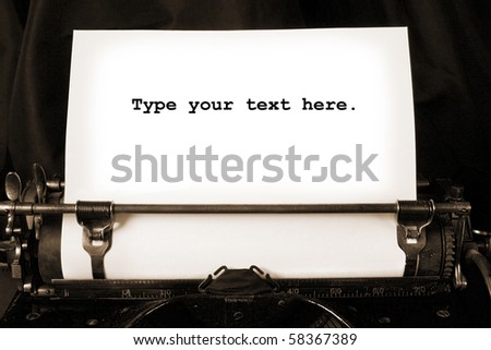 Old type writer with a blank sheet of paper
